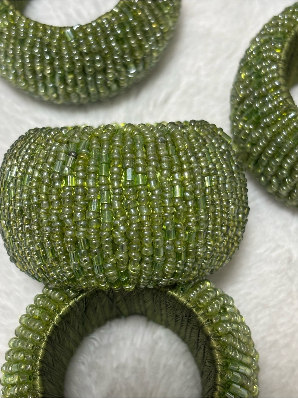 Six beaded green round napkin ring holders